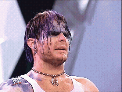 Man With Purple Hair Wearing White Tank Top And H Necklace GIF