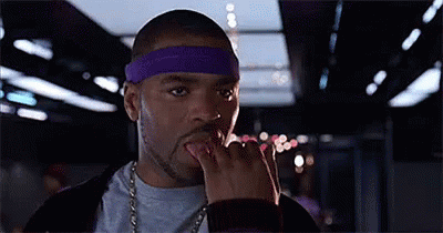 Man With Purple Headband Licking Fingers GIF