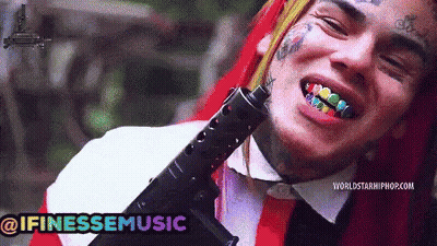 Man With Rainbow Teeth Holding Gun @Ifinessemusic GIF