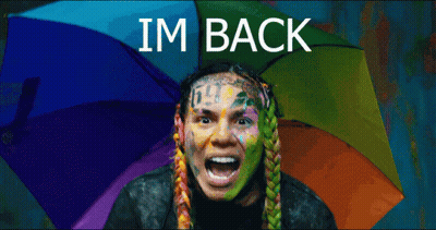 Man With Rainbow Umbrella Saying I'm Back GIF