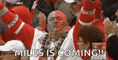Man With Red And White Face Paint Says Miles Is Coming GIF