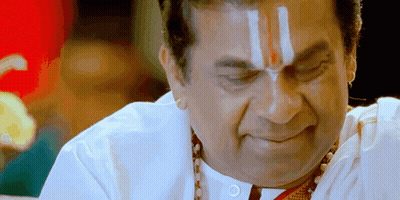 Man With Red And White Stripe On Forehead Looking Down GIF
