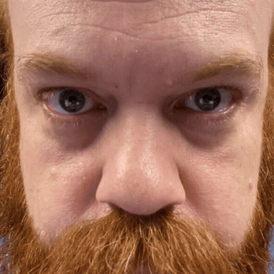 Man With Red Beard And Blue Eyes Looking At Camera GIF