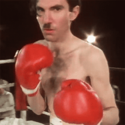 Man With Red Boxing Gloves And Mustache GIF