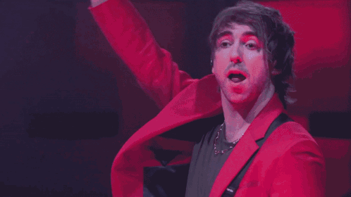 Man With Red Clown Nose And Pink Jacket GIF