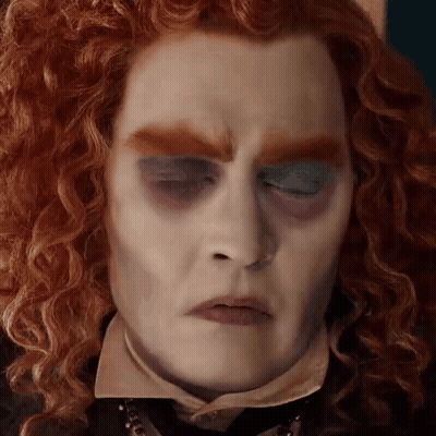 Man With Red Curly Hair And Blue Eyeshadow GIF