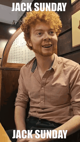 Man With Red Curly Hair Sitting In Booth Jack Sunday GIF