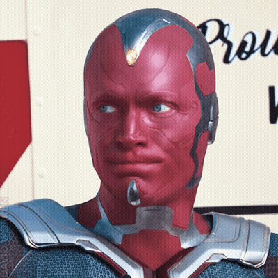 Man With Red Eyes And Silver Helmet In Front Of Production Sign GIF