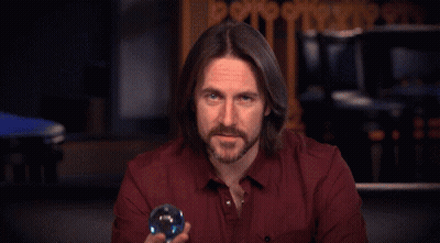 Man With Red Eyes Holding Blue Sphere GIF
