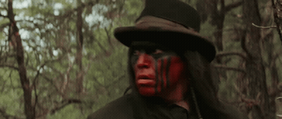 Man With Red Face Paint And Top Hat GIF