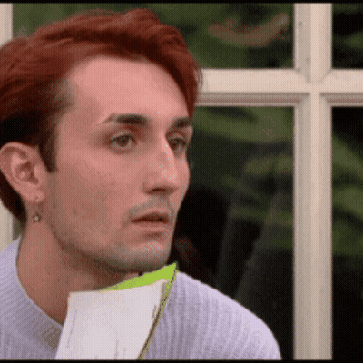 Man With Red Hair Holding Paper GIF