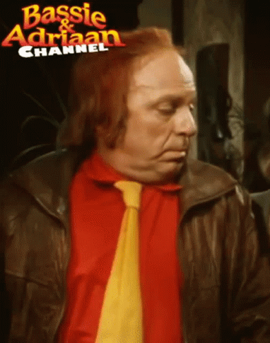 Man With Red Hair Red Shirt And Yellow Tie GIF