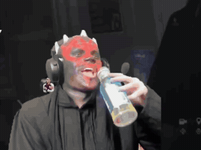 Man With Red Mask Drinking Bottle Of Soda GIF