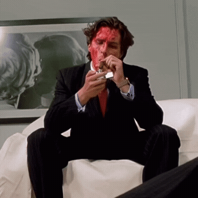 Man With Red Paint On Face Sitting On Couch GIF
