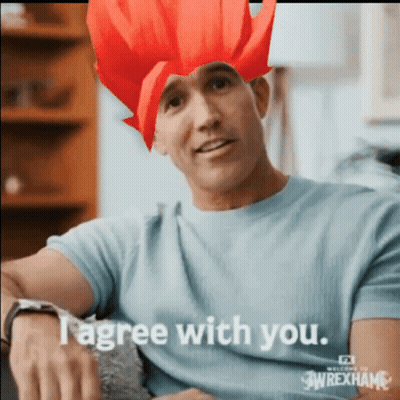 Man With Red Wig And Blue Shirt Saying I Agree GIF