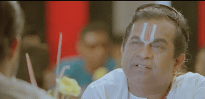 Man With Religious Symbol Forehead Talking to Another