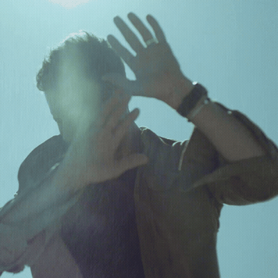 Man With Ring Covering Face GIF
