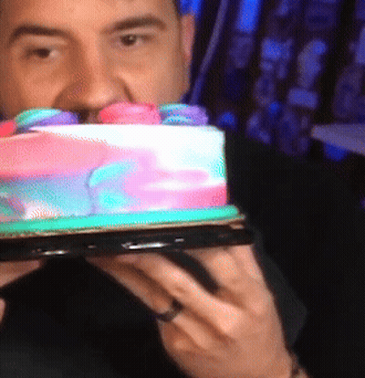Man With Ring Holding Rainbow Cake