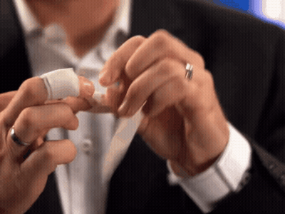 Man With Ring Holding Tape On Finger GIF