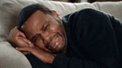 Man With Ring Laying On Couch Eyes Closed GIF