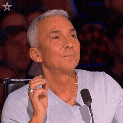 Man With Ring Sitting At Microphone GIF