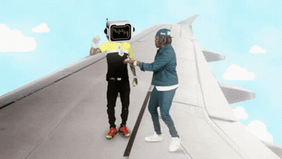 Man With Robot Head Talks To Another Man On Plane Wing GIF