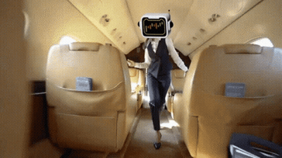Man With Robot Head Talks To Another Man On Plane Wing GIF