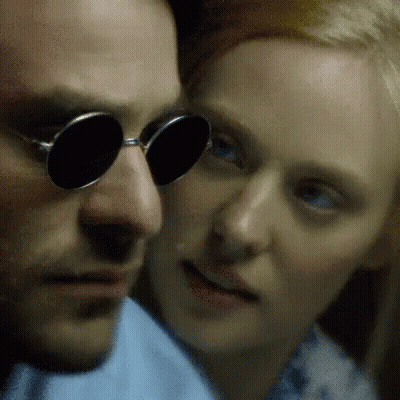 Man With Round Sunglasses Looking At Woman GIF