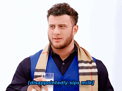 Man With Scarf Disappointed Sips Milk GIF