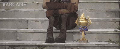 Man With Several Trophies Including Premier League GIF