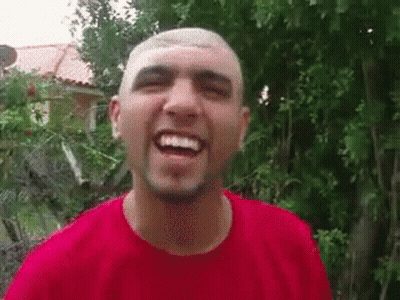 Man With Shaved Head And Beard Smiling In Red Shirt GIF