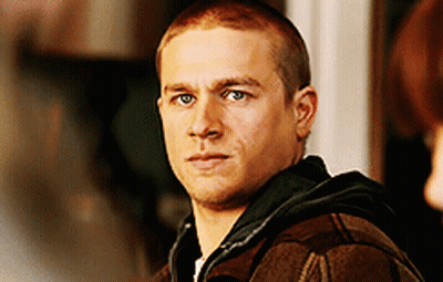 Man With Shaved Head In Plaid Jacket And Black Hoodie GIF