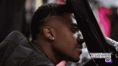 Man With Shaved Head Looking Out Car Window GIF