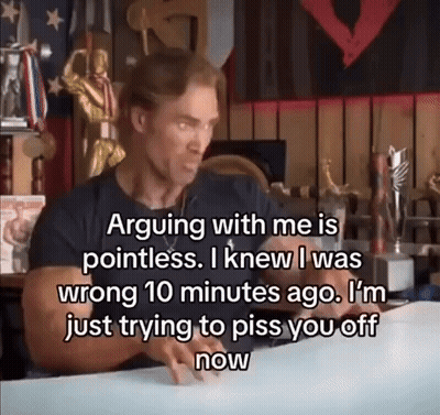 Man With Sign Saying Arguing With Me Is Pointless GIF