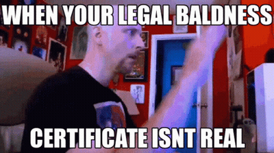Man With Sign Saying When Your Legal Baldness Certificate Isn't Real