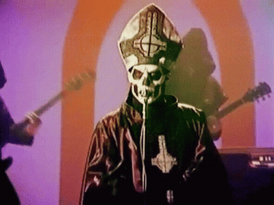Man With Skull Face Singing Into Microphone GIF