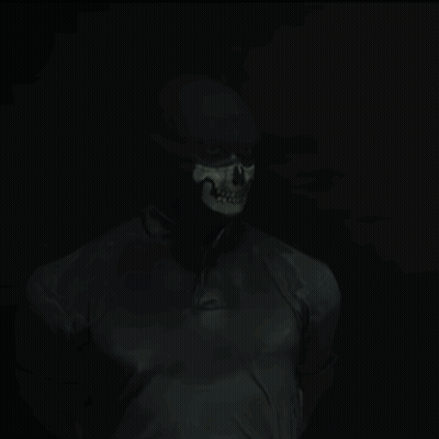 Man With Skull Painted Face In Dark GIF