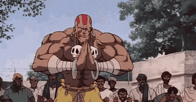 Man With Skulls On Arms Standing In Front Of Crowd GIF