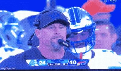 Man With Sony Microphone In Front Of Football Helmet GIF