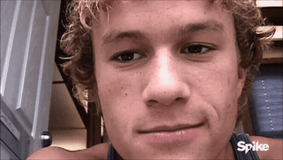 Man With Spike Logo Behind Him GIF