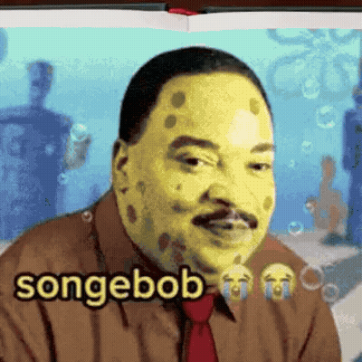 Man With Spongebob Face Paint Wearing Brown Shirt And Tie GIF