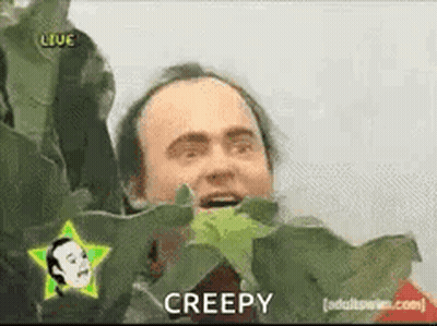 Man With Star On Head Holding Plant Saying Creepy GIF