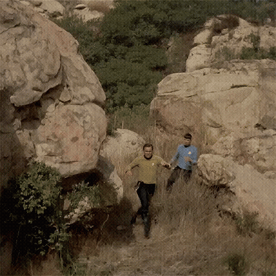 Man With Star Trek Logo Running Down Trail GIF