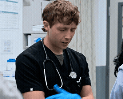 Man With Stethoscope in Black Scrub