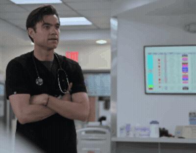 Man With Stethoscope In Front Of Exit Sign GIF