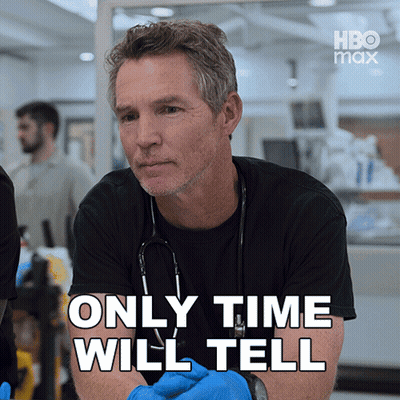 Man With Stethoscope In Front Of Only Time Will Tell Sign GIF