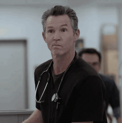 Man With Stethoscope Looking At Camera GIF