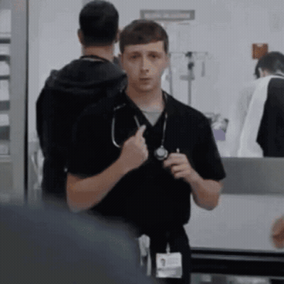 Man With Stethoscope Standing Next To Another Man GIF