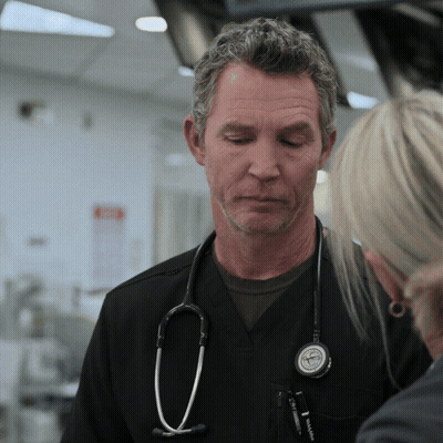 Man With Stethoscope Talking To Woman In Hospital GIF