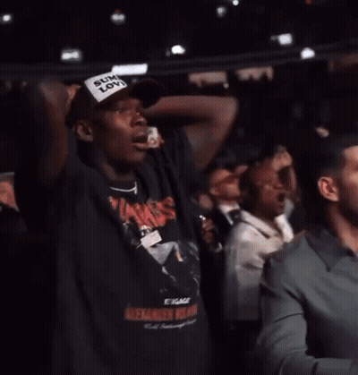Man With Sum Love Hat Between Two Men GIF